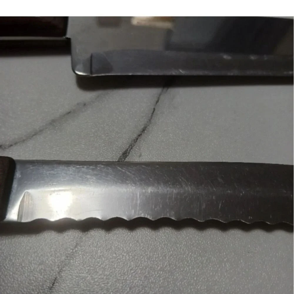 Pair of stainless steel Knives by Flint made in USA Surface scratches Partial